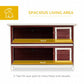 Two-tier rabbit hutch interior with platforms and enclosed wire-mesh compartments