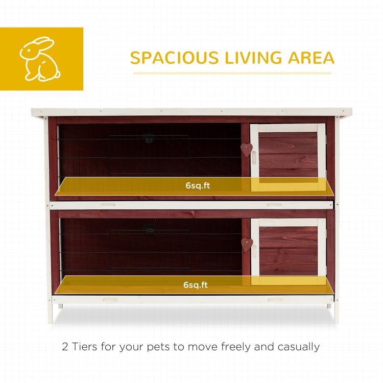 Two-tier rabbit hutch interior with platforms and enclosed wire-mesh compartments