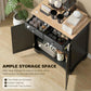 Black kitchen cabinet with light wood top, open drawers and side doors for storage