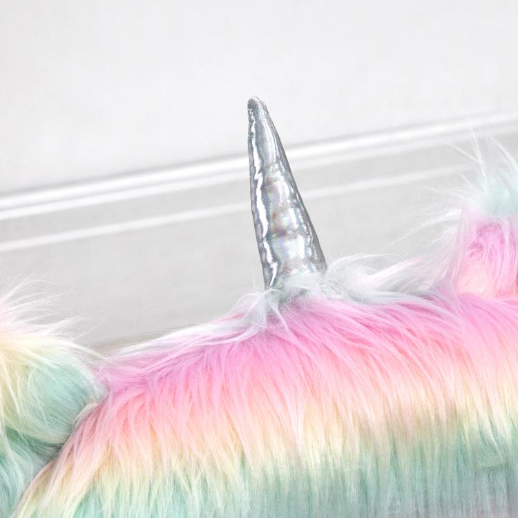 Close-up of rainbow unicorn plush chair horn and textured fluffy backrest