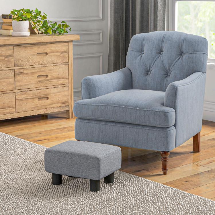 Gray cube foot rest ottoman with padded fabric top and black legs