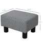 Gray cube ottoman with padded top and four black plastic legs