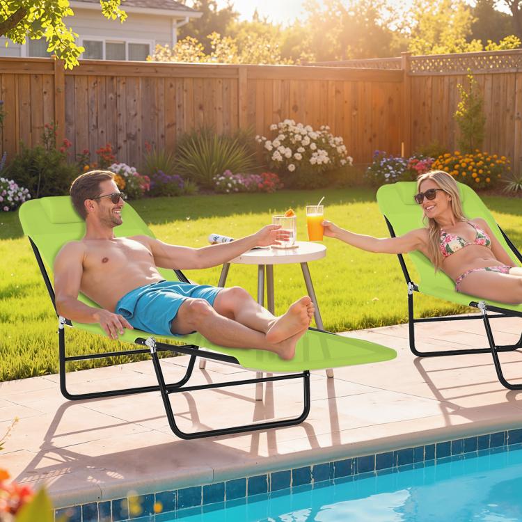 Green outdoor lounge chaise with reclining back and black folding base