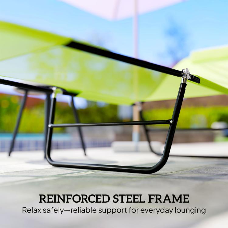 Close-up of reinforced black steel frame on green folding chaise lounge chair
