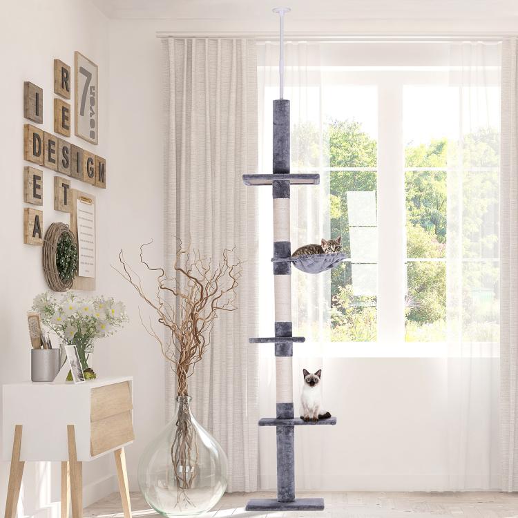 Gray cat tree with hammock perch and stacked scratching platforms for cats