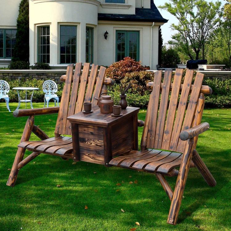 Rustic wooden adirondack loveseat with central ice bucket table on outdoor lawn