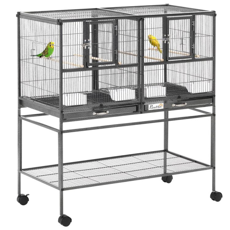 Divided metal bird cage on rolling stand with wood perches and removable tray