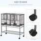Divided metal bird cage on rolling stand with four universal wheels and braking casters
