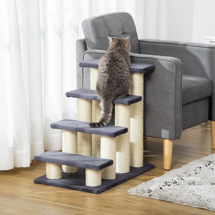 Cat climbing tower with four dark steps and cream sisal posts, cat perched on top