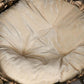 Woven cat bed cushion close-up with beige fabric filling