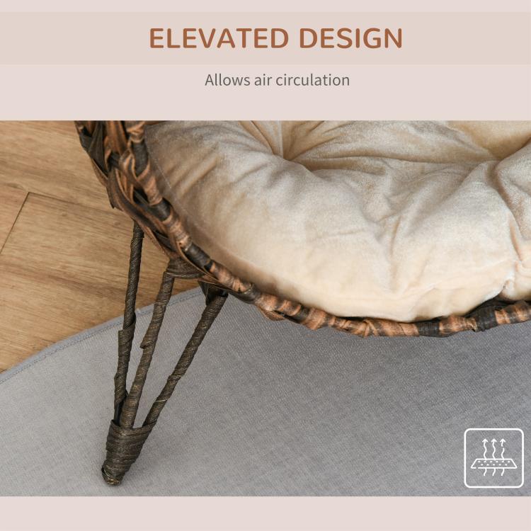 Elevated woven cat bed with cream cushion allowing airflow under the basket
