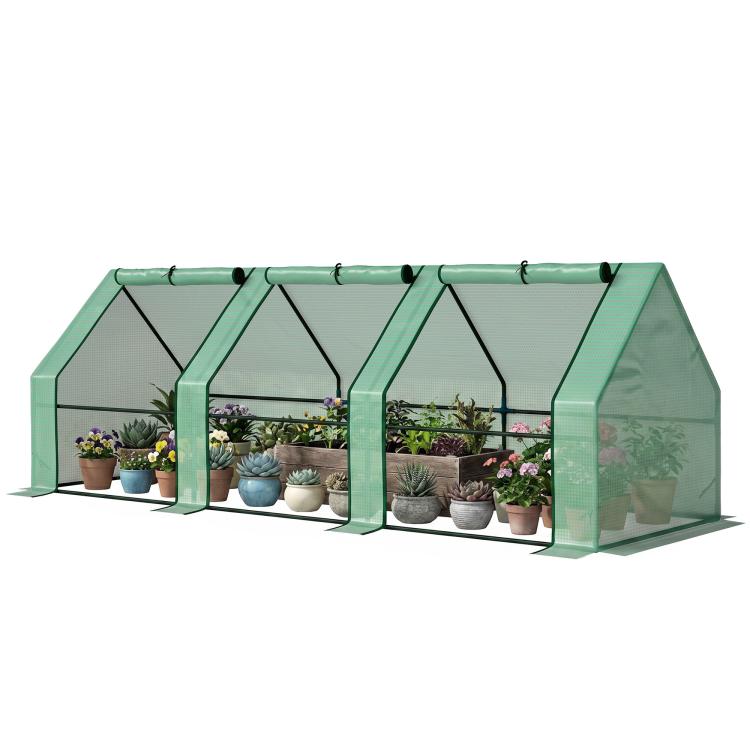 Portable mini greenhouse with green mesh cover and front zipper doors, plants inside