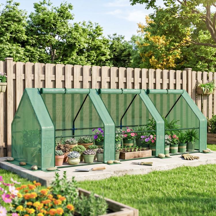Green mesh mini greenhouse with open front door panels and potted plants along shelves