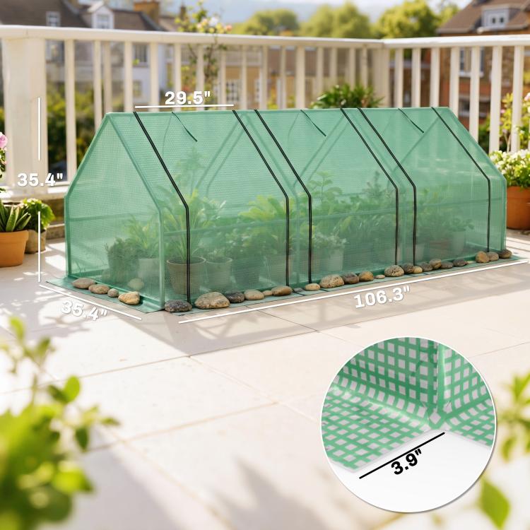 Green portable mini greenhouse on patio with mesh walls, shown with size markings