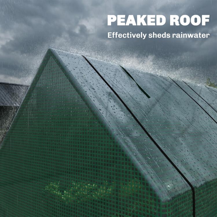 Green greenhouse peaked roof with water droplets on the mesh cover surface