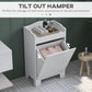 White tilt-out laundry cabinet with open hamper drawer and curved top shelf