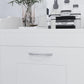 Close-up of white cabinet front with curved metal handle and recessed door panel