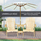 Natural wood two-person Adirondack bench with built-in umbrella hole and central umbrella stand.