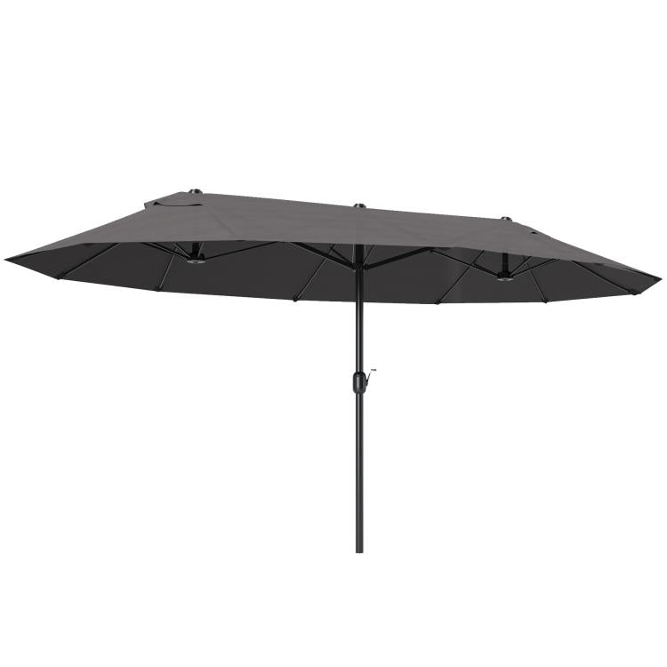 Gray patio umbrella with crank lift and open canopy over a central pole