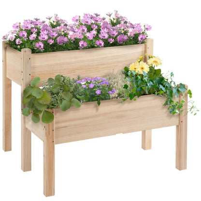 Two-tier raised wooden planter bed with pink and purple flowers