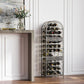 Antique bronze wine bottle rack with bottles, arched cage and decorative scrollwork