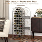 Antique bronze metal wine bottle rack holding bottles, arched cage and side door