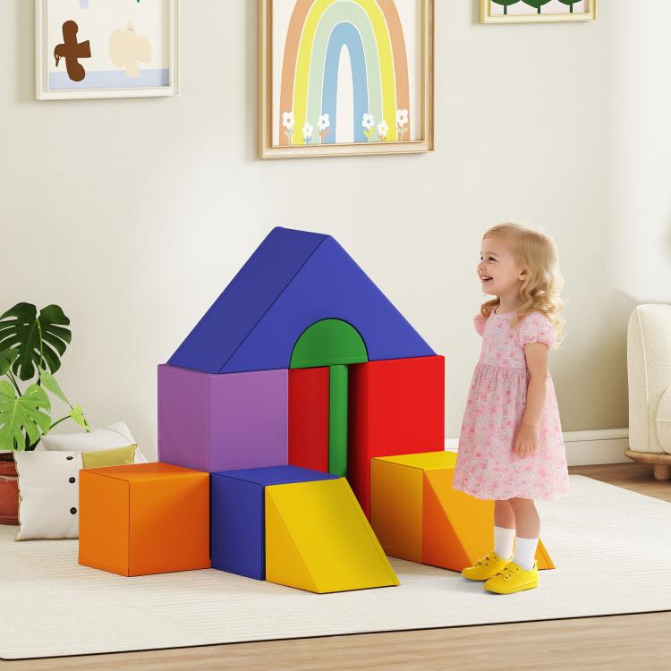 Kids foam climbing play house with rainbow colored blocks and slide ramp