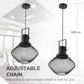 Two black pendant lights with wire mesh shades and adjustable hanging chains