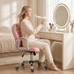 Pink button-tufted office chair with chrome base and rolling casters in use