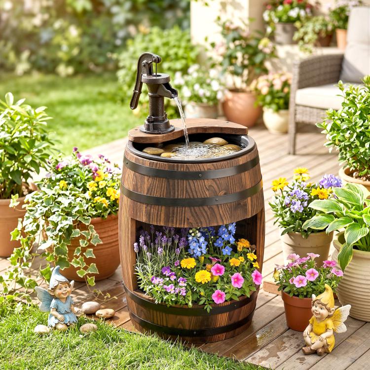 Rustic wooden barrel water fountain with black pump and flower basket design, outdoor setting