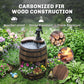 Rustic wooden barrel water fountain with black pump, plants and birds around the planter