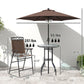 Patio bar set with brown umbrella, two folding chairs, and round wave-textured glass table