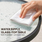 Wave-textured tempered glass tabletop with water droplets