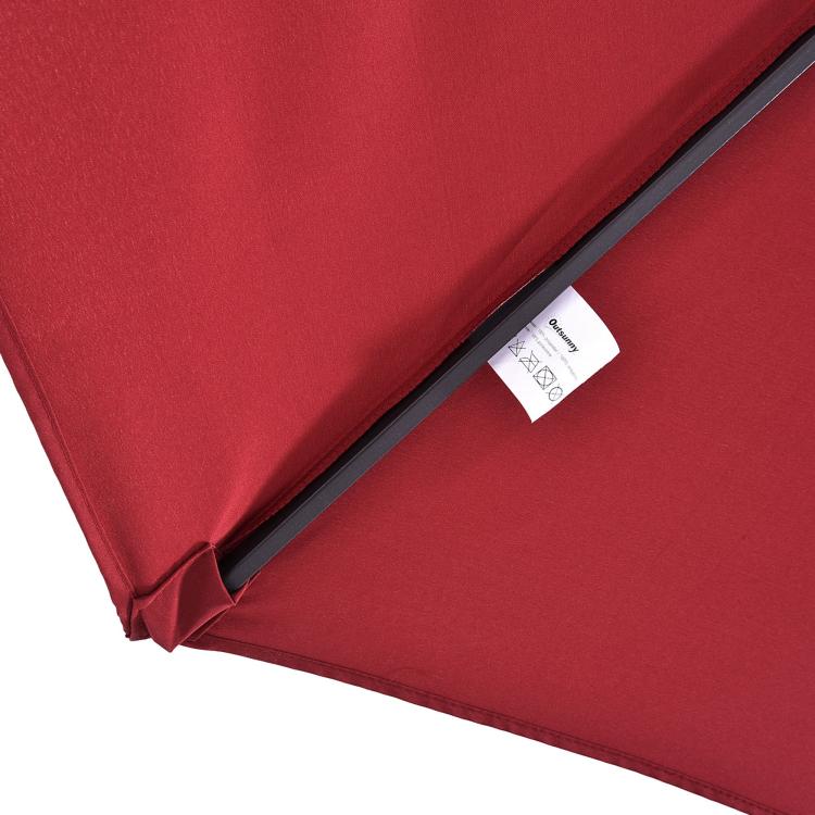 Wine red patio umbrella fabric panel with reinforced seam and care label