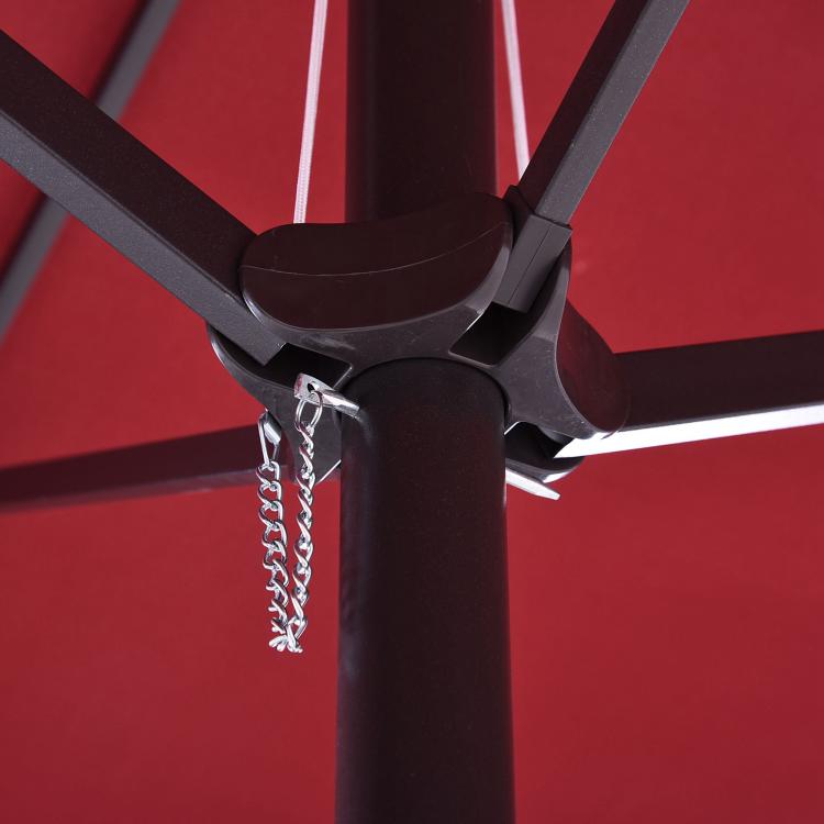 Wine red patio umbrella crank handle on dark pole with chain detail