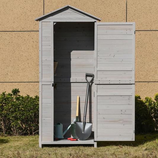 White wooden storage shed cabinet with open doors and gardening tools inside