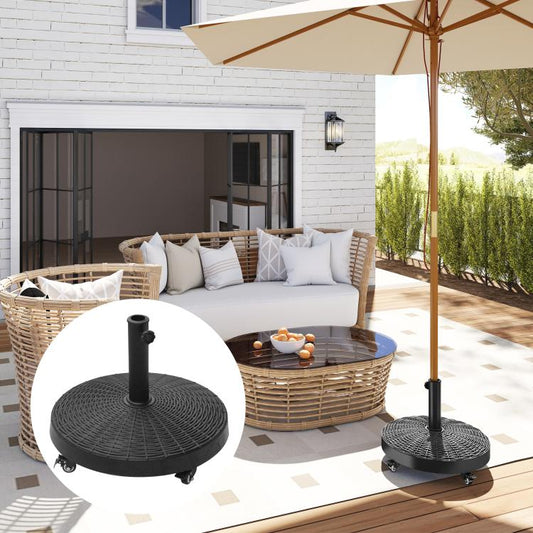 Black umbrella base stand with pole holder and four caster wheels on patio