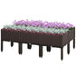 Brown raised garden bed planter box with legs, filled with purple flowers and greenery