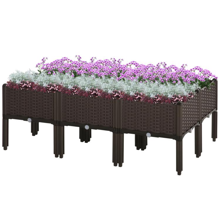 Brown raised garden bed planter box with legs, filled with purple flowers and greenery