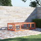 Outdoor rabbit hutch with wire mesh walls and open front run on patio