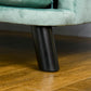 Green pet sofa cushion on dark tapered solid wood legs