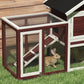 Rabbit hutch corner with ramp, wire mesh pen, and a rabbit at the door