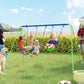 Outdoor A-frame swing set with three children riding green-and-blue seats