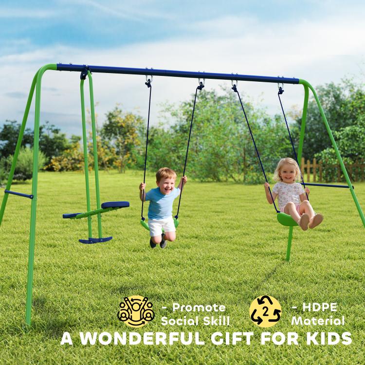 Outdoor green swing set with two blue seats, two kids swinging on yard grass