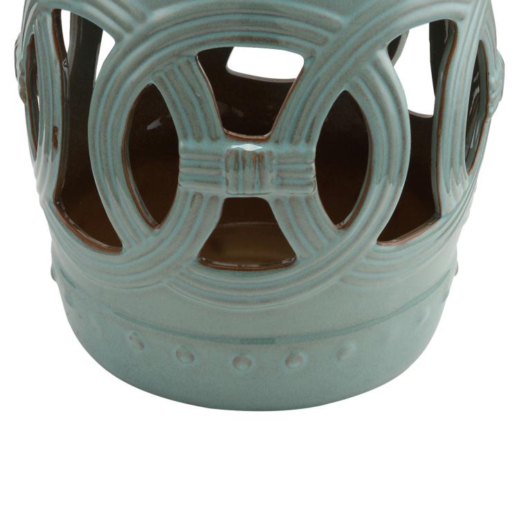 Ceramic garden stool in antique blue with circular cutout ring pattern and hollow top
