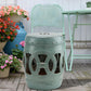Antique blue ceramic garden stool with glazed double-coin ring cutouts and round lid top.