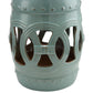 Antique blue ceramic garden stool front view with glazed double-coin ring cutout pattern.