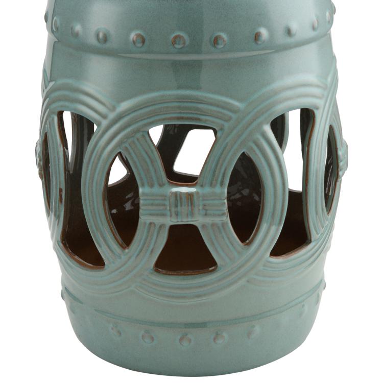 Antique blue ceramic garden stool front view with glazed double-coin ring cutout pattern.