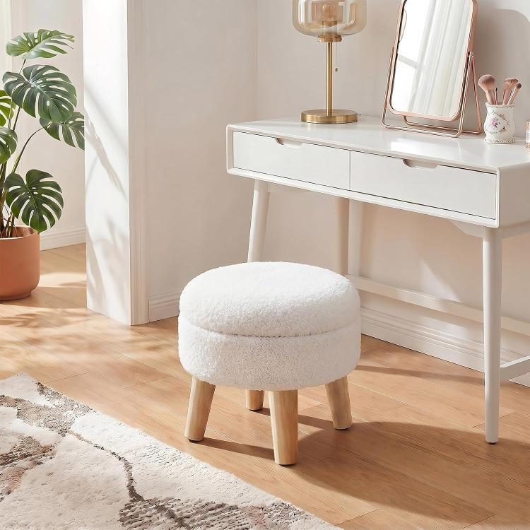 Beige round storage ottoman with boucle upholstery and solid wood legs
