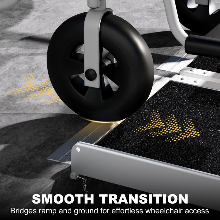 Wheelchair ramp with black textured surface and smooth transition to ground